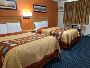Postel nebo postele na pokoji v ubytování Westway Inn Motel