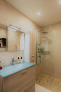 a bathroom with a sink and a shower at Mallorca escape in Portals Nous