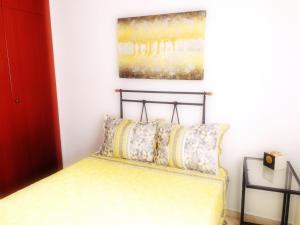 A bed or beds in a room at Benalmarina Sea View Apartments