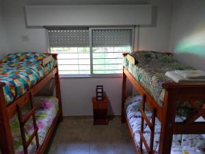 two bunk beds in a room with a window at CASA FUNES in Funes +46 photos