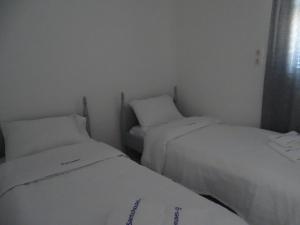 Postel nebo postele na pokoji v ubytování NAMA Beach house