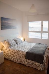 Voodi või voodid majutusasutuse LivingtheOcean & Big Terrace toas