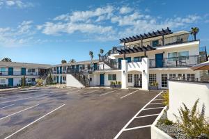 a parking lot in front of a building at The Shoal Hotel La Jolla Beach in San Diego