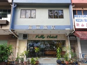 a building with a fake hotel on a street at FULLY HOTEL JOHOR JAYA in Johor Bahru
