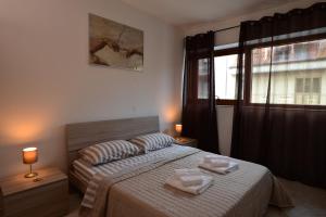 a bedroom with a bed with two towels on it at ITALY-HOUSE Brigida 100 Termoli Molise in Termoli +61 photos