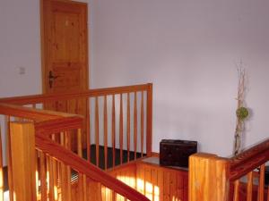 a room with a wooden staircase with a radio at Pension Redefin in Redefin