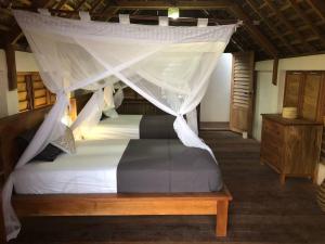 Кровать или кровати в номере Villa Tunggaoen