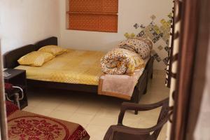 Ένα ή περισσότερα κρεβάτια σε δωμάτιο στο Nadya Homestay For Female & family