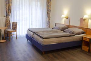Postel nebo postele na pokoji v ubytování Hotel Restaurant Waldlust