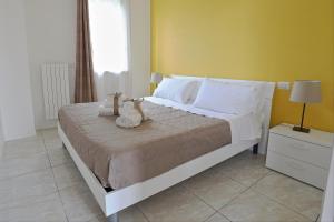 Postel nebo postele na pokoji v ubytování B&B POGGIO DEL SOLE