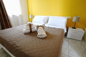 Postel nebo postele na pokoji v ubytování B&B POGGIO DEL SOLE
