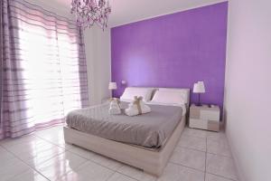 Postel nebo postele na pokoji v ubytování B&B POGGIO DEL SOLE