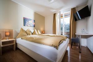 Letto o letti in una camera di Jungfrau Hotel
