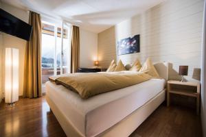 Letto o letti in una camera di Jungfrau Hotel