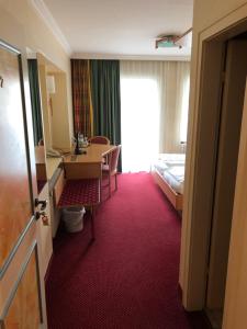 Postel nebo postele na pokoji v ubytování Hotel Pflieger