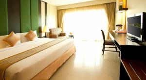 Ein Bett oder Betten in einem Zimmer der Unterkunft Intimate Hotel Pattaya - SHA Extra Plus