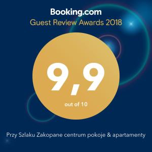 a flyer for a guest review awards with a yellow circle at Przy Szlaku Zakopane centrum pokoje & apartamenty in Zakopane