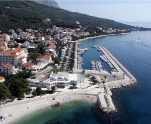 an aerial view of a beach with boats in the water at House Villa Roza in Tučepi