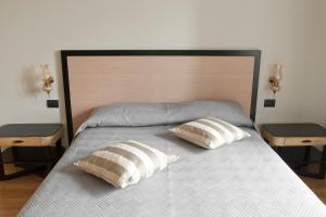 A bed or beds in a room at Le Cupoline