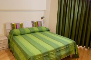 A bed or beds in a room at Le Cupoline