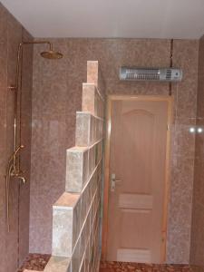 a bathroom with a staircase next to a shower at Sam guest house in Jajce +39 photos