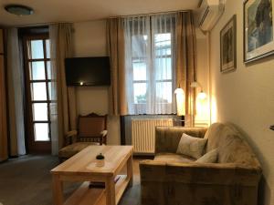 a living room with a couch and a coffee table at Apartmaji Sušnik in Bled