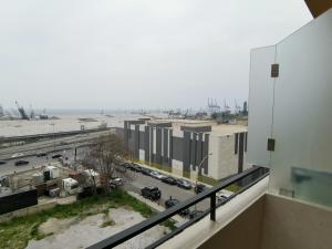 a balcony with a view of a parking lot at West House Apartments-Mar Mikhael in Beirut