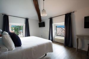 Postel nebo postele na pokoji v ubytování Hotel Orso Bruno
