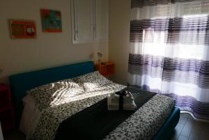 Postel nebo postele na pokoji v ubytování B&B Ai Tre Archi