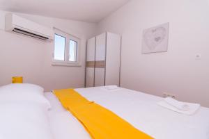 Posteľ alebo postele v izbe v ubytovaní APARTMENT ABA