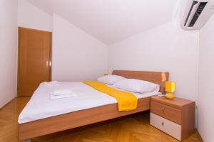 Posteľ alebo postele v izbe v ubytovaní APARTMENT ABA