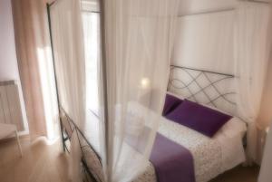 Postel nebo postele na pokoji v ubytování B&B Ai Tre Archi