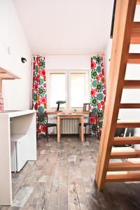 a living room with a desk and a table at Szmulson in Warsaw