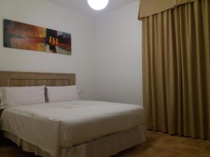 Katil atau katil-katil dalam bilik di La casa del viajero
