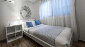 Postel nebo postele na pokoji v ubytování Lemar Luxury Apartments