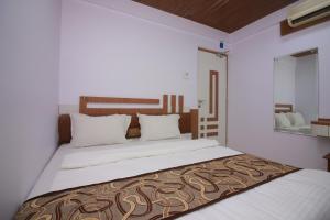 Katil atau katil-katil dalam bilik di Hotel Apex