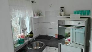 Kuchyňa alebo kuchynka v ubytovaní Studio Apartman Vortex