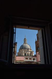 a building with a clock tower in the background at AmaMantua in Mantova