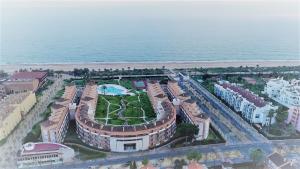 an aerial view of a building next to the ocean at Islantur Las Américas in Islantilla