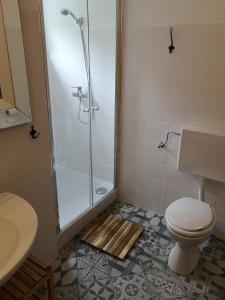Koupelna v ubytování Apartments Bassi