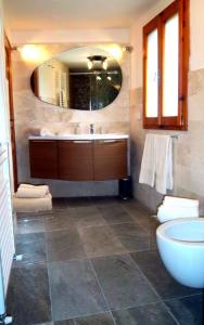 a bathroom with a sink and a mirror at Crocino in Loro Ciuffenna