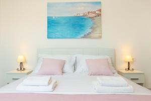 Postel nebo postele na pokoji v ubytování Holiday Apartments Dubrovnik
