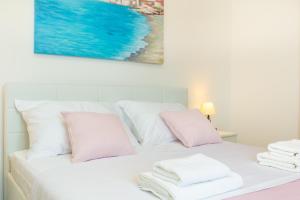 Postel nebo postele na pokoji v ubytování Holiday Apartments Dubrovnik