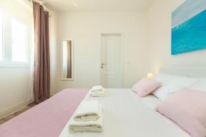 Postel nebo postele na pokoji v ubytování Holiday Apartments Dubrovnik