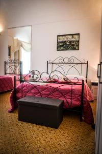 a bedroom with two beds and a mirror at The Artist's Home Catania Centro in Catania