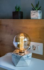 a light sitting on top of a marble table at Nest of Marmel Luxury Studio in Chania