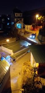 an overhead view of a parking lot at night at Nón Lá Guest House in Da Lat