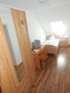 Postel nebo postele na pokoji v ubytování Hotel Garni am Hechenberg
