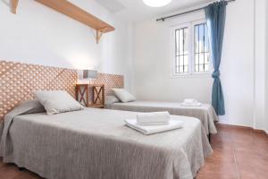 Postel nebo postele na pokoji v ubytování Casa Aloe Pro