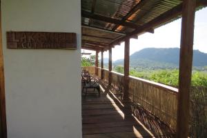 a porch of a building with a view of a mountain at Gateway Guest House in Monkey Bay